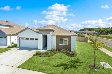 Second front angle showcasing elevation & driveway