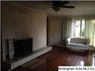 This room can be used as a dining room or a den. I