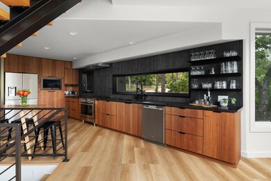 Kitchen featuring modern cabinets, stainless stee