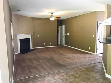 Open floorplan from eat in kitchen to living room.  Living room leads to half bath, office and 2 car garage with lots of built in cabinets and storage.