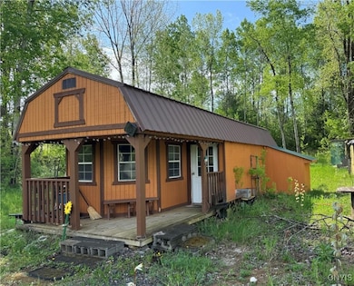 Another view of the L-shaped covered front porch a