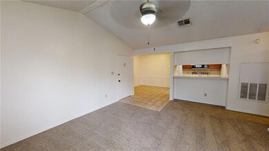 Unfurnished living room with a ceiling fan, lofte