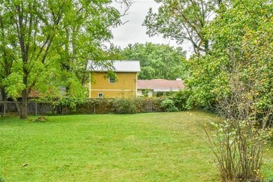 Cleared level, fenced lot; View from Parkman Place