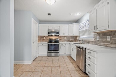 Updated kitchen with stainless steel appliances, q