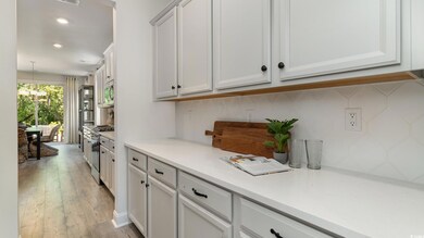 Kitchen featuring decorative backsplash, stainless