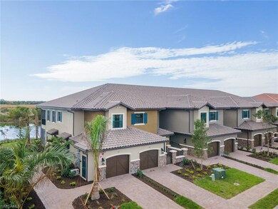Mediterranean / spanish-style house featuring stucco siding, a garage, decorative driveway, a tiled roof, and stone siding
