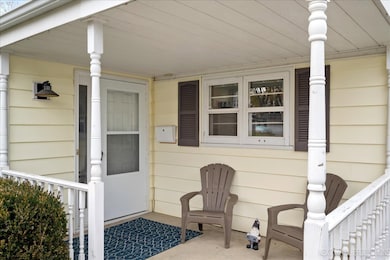 Covered front porch welcomes friends and offers a