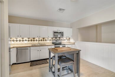 Kitchen with undercounter lighting and tiled backs