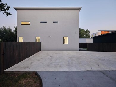 Rear view of property featuring stucco siding and a patio area