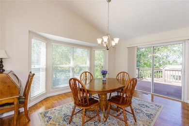 The dining area has a bay window and sliding doors