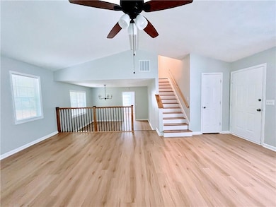 Spare room with vaulted ceiling, ceiling fan with 