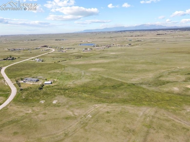 Birds eye view of property featuring a rural view