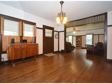 Living Room. The home s original woodwork and fixt