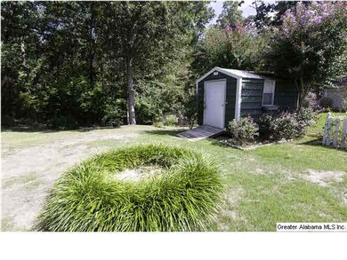 There are 2 storage buildings in the fenced yard. 