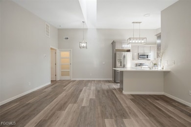 Unfurnished living room featuring light wood-style