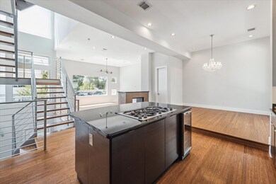 The gas cooktop and beverage refrigerator make thi