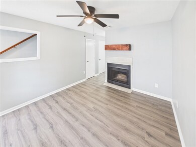 Unfurnished living room featuring a tile fireplace