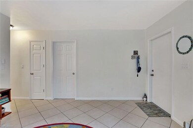Entrance foyer featuring light tile patterned floo