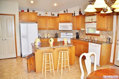 KITCHET HAS PANTRY AND CENTER ISLAND WITH EATING B