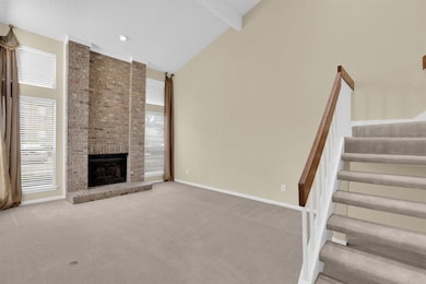 Unfurnished living room with carpet floors, high v