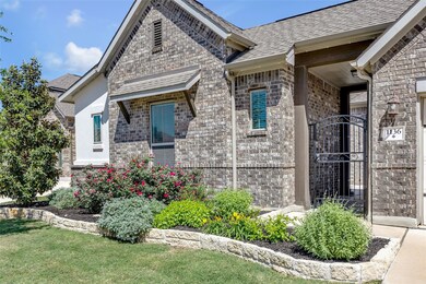 View of side of home featuring a gate, roof with 