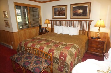 Carpeted bedroom featuring crown molding