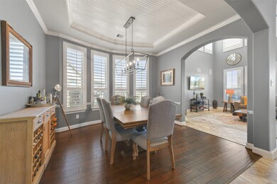 Formal dining is open to family room and kitchen a