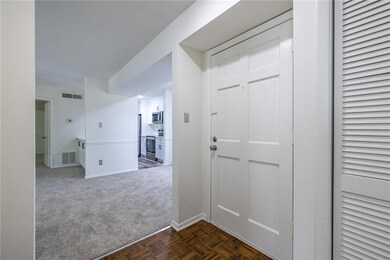 Step inside to a bright and welcoming foyer that o