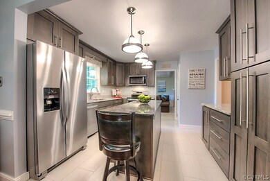 Updated kitchen. New Stainless Appls. Tile Floorin