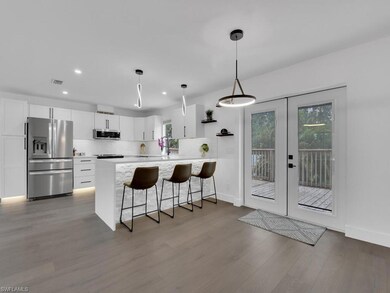 Kitchen featuring kitchen peninsula, stainless ste