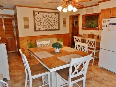 Breakfast bar and opening to dining and living roo