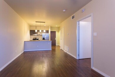 Unfurnished living room with dark hardwood / wood-