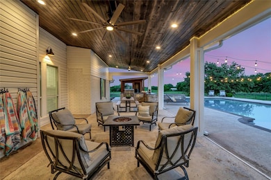 Huge covered patio with built in outdoor kitchen.