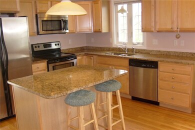 Kitchen Island with overhang.  Stainless appliance