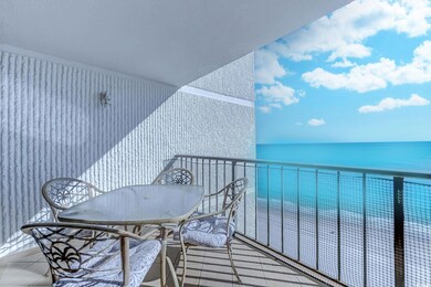 Balcony featuring a water view and a view of the b