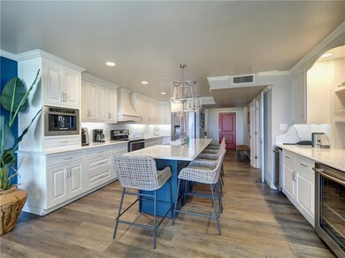 Modern, upscale kitchen with a long central island