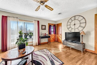Living room with original hardwood floors and larg