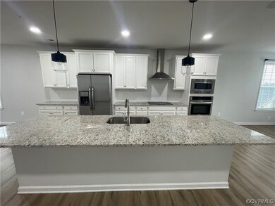 Kitchen with decorative light fixtures, wood-type
