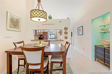 Dining area with pass through to kitchen with tile
