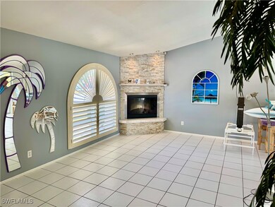 Tiled living room with a fireplace
