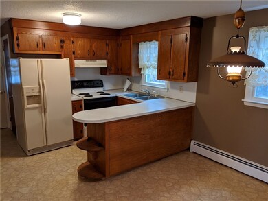 Walk to all the events in downtown Westerly from a convenient rental Ranch at 32 Spring Street just off of Cross Street. The living room opens up to the kitchen and dining room while down the hall are the three bedrooms with nice hardwood floors and a bathroom.  Next to the kitchen is a three season porch with both windows and screens.  The attached garage is part of the unfinished basement. The backyard is perfect for grilling and badminton!  Check it out!