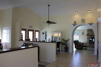 Wide and welcoming entry ushers guests to living r