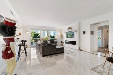 Living room with ornamental molding, a glass cover