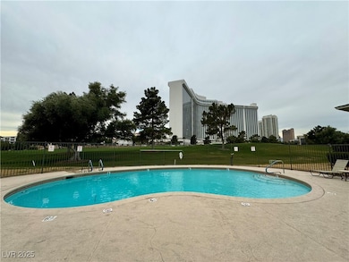 Community pool featuring a patio area