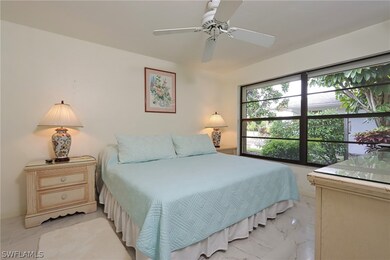 Bedroom featuring ceiling fan and light tile floor