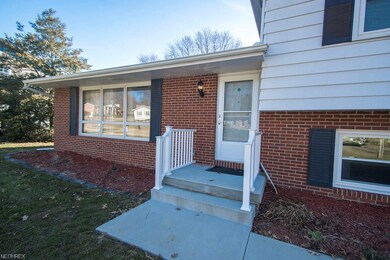 Inviting front porch with new storm door.