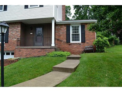Exterior Front. Concrete walk leads to covered fro