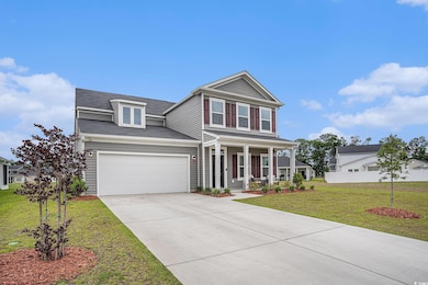 Traditional-style home with covered porch, concrete driveway, a front lawn, and a shingled roof