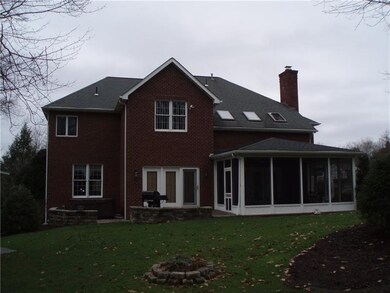 Back view w/screened patio, hot and grill area