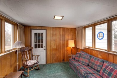 A cozy sunroom connects the attached garage.  A ni